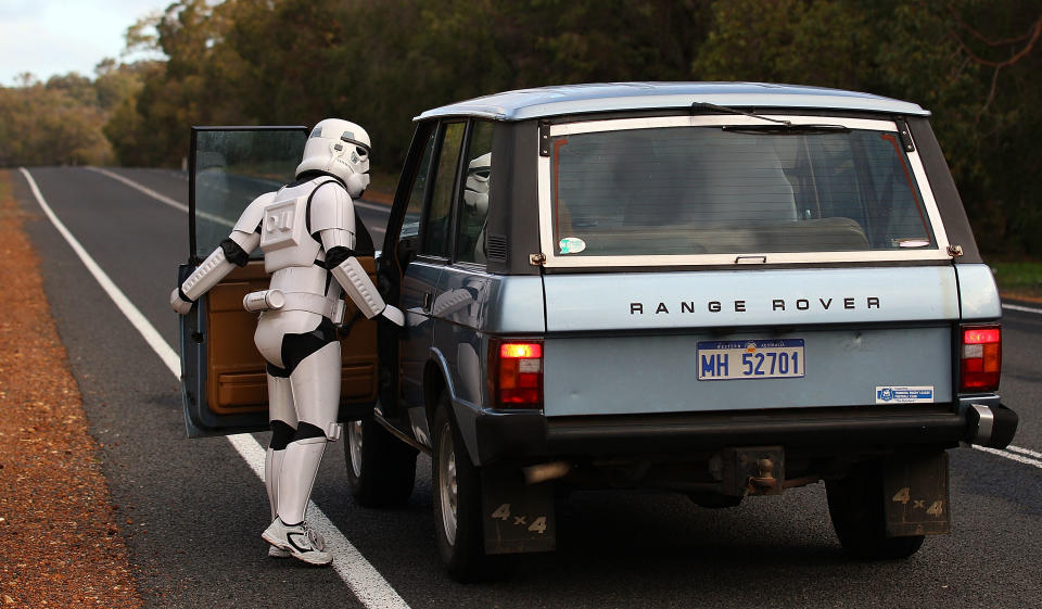 PERTH, AUSTRALIA - JULY 15: Stormtrooper Paul French talks to a passing motorist on day 5 of his over 4,000 kilometre journey from Perth to Sydney approximately 25 kilometres from Mandurah on July 15, 2011 in Perth, Australia. French aims to walk 35-40 kilometres a day, 5 days a week, in full Stormtrooper costume until he reaches Sydney. French is walking to raise money for the Starlight Foundation - an organisation that aims to brighten the lives of ill and hostpitalised children in Australia. (Photo by Paul Kane/Getty Images)