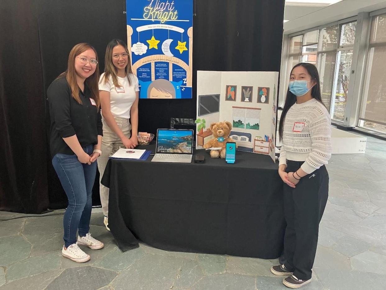 A team of NAIT biomedical engineering technology students, consisting of Denise Alinsasaguin, Paulina Deng and Nicolette Angara, was nominated for a prestigious provincial prize for making a baby sleep monitoring device out of a teddy bear  (Submitted by ASET - image credit)