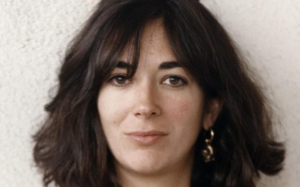 Ghislaine Maxwell, youngest child of media proprietor and fraudster, Robert Maxwell (1923 - 1991), holding a framed photograph of her late father, Jerusalem, Israel, 9th November 1991. (Photo by Ken Lennox/Mirrorpix/Getty Images) - Ken Lennox/Mirrorpix/Getty Images