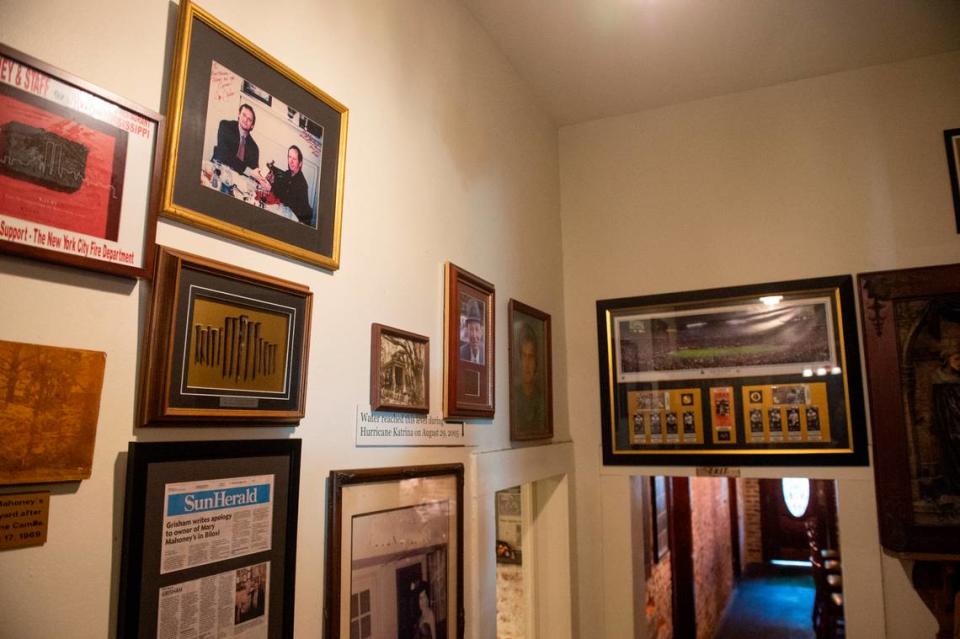 Photos and memorabilia line the walls of Mary Mahoney’s in Biloxi on Friday, Jan. 27, 2023. A photo of John Grisham, a Biloxi native author, dining at the restaurant hangs in the top corner.