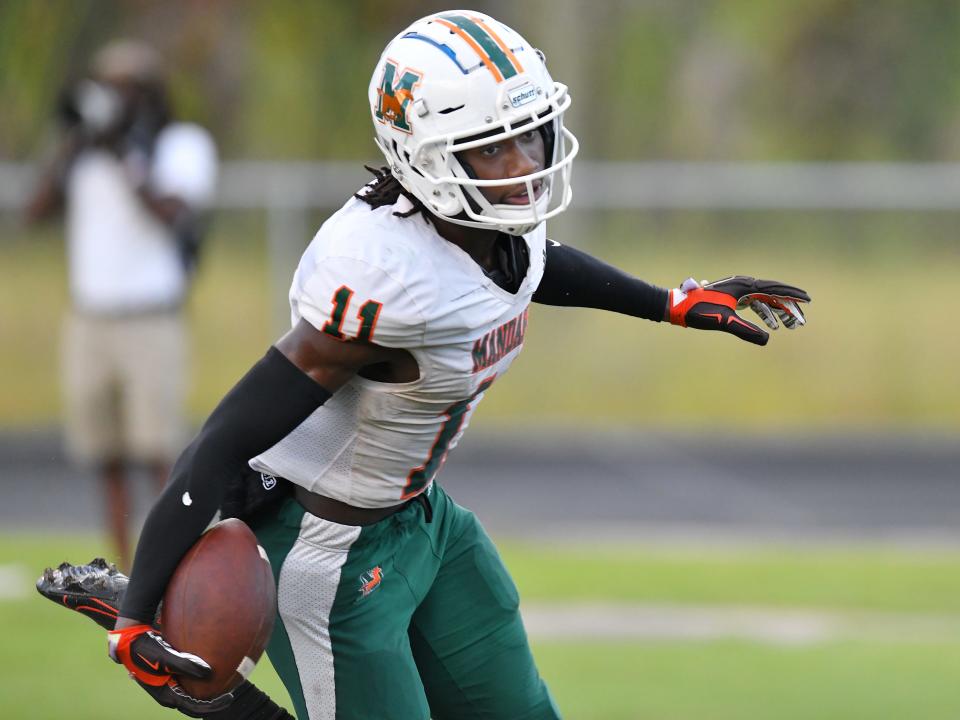 Mandarin wide receiver Jeremiah Shack (11) runs through the end zone after pulling in a touchdown pass in an October game against White.