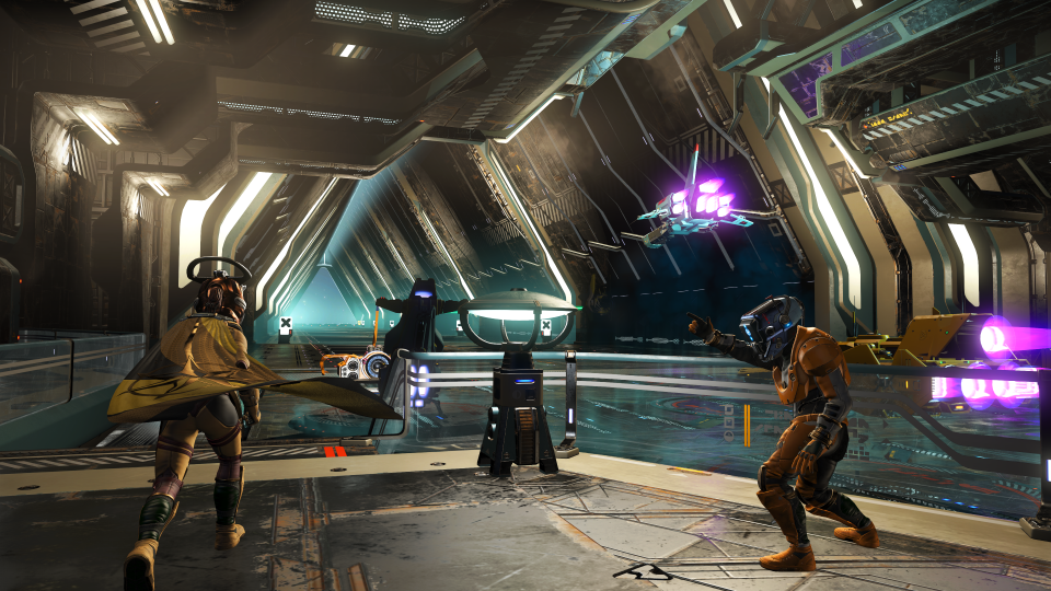 Interiors of new procedurally generated space stations in No Man's Sky.  In the foreground of the space hangar stand three moving characters as the ships whiz by.