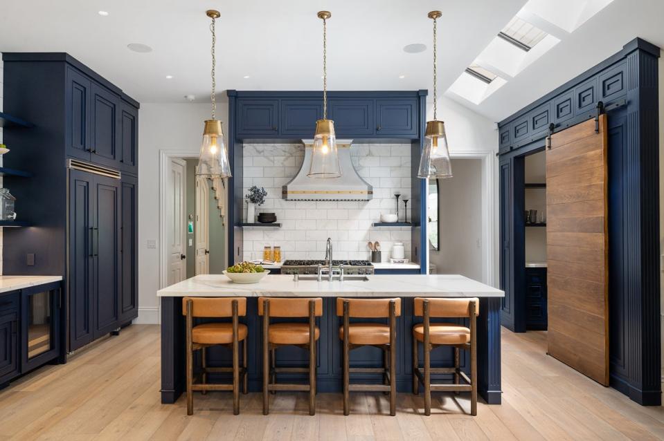 Kitchen with marble countertop. The residence at 1709 Broderick Street boasts a “timeless contemporary sophistication” with mostly light wood floors spanning its 3,7000 square feet (Lunghi Studio)