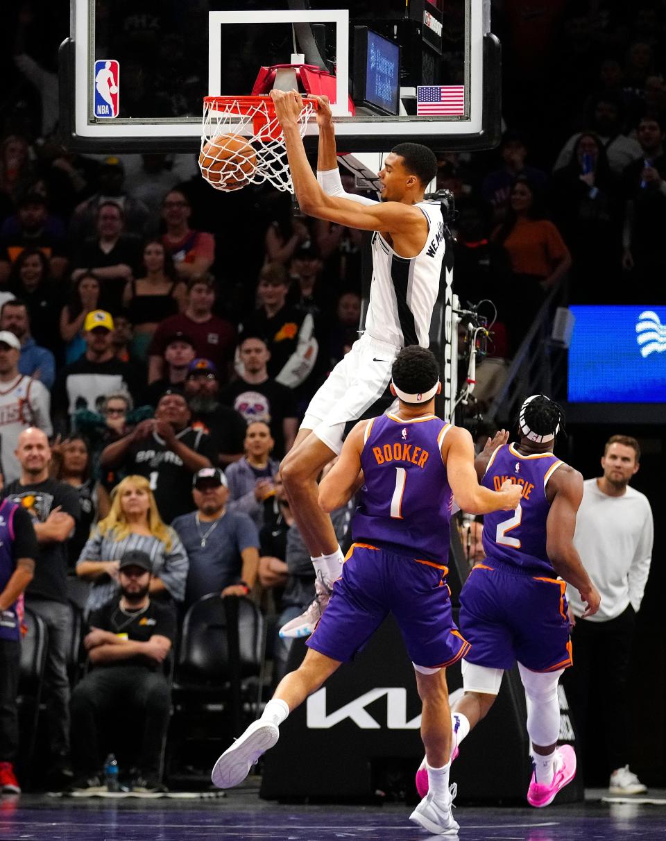 Spurs center Victor Wembanyama (1) dunks against the Suns during the first half at Footprint Center in Phoenix on Nov. 2, 2023.