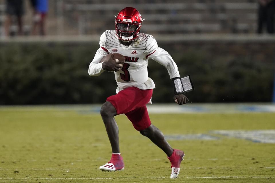 Louisville quarterback Malik Cunningham runs against Duke.