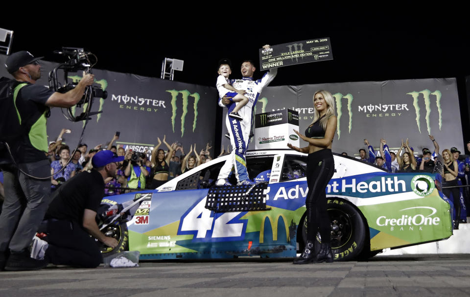 Kyle Larson celebrates in Victory Lane after winning the NASCAR All-Star Race at Charlotte Motor Speedway in Concord, N.C., Saturday, May 18, 2019. (AP Photo/Chuck Burton)