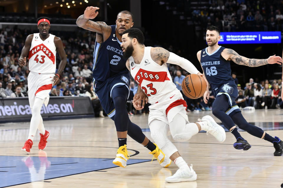 Toronto Raptors guard Fred VanVleet (23) drives against Memphis Grizzlies forward Xavier Tillman (2) in the first half of an NBA basketball game Sunday, Feb. 5, 2023, in Memphis, Tenn. (AP Photo/Brandon Dill)