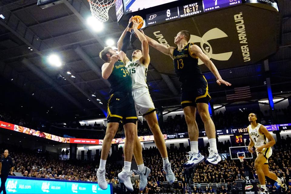 Dec 1, 2023; Evanston, Illinois, USA; Northwestern Wildcats center Matthew Nicholson (34) defends Purdue Boilermakers center Zach Edey (15) during the first half at Welsh-Ryan Arena. Mandatory Credit: David Banks-USA TODAY Sports