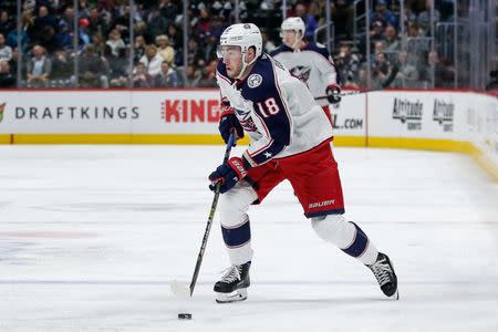 Feb 5, 2019; Denver, CO, USA; Columbus Blue Jackets center Pierre-Luc Dubois (18) controls the puck in the first period against the Colorado Avalanche at the Pepsi Center. Mandatory Credit: Isaiah J. Downing-USA TODAY Sports