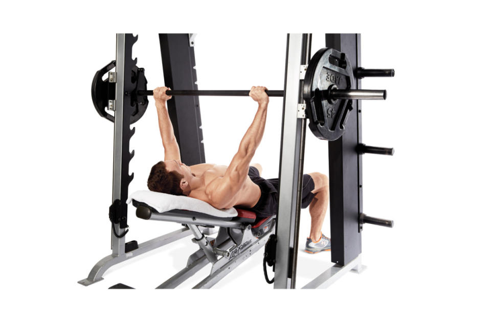 How to do it:<ol><li>Set an adjustable bench to a 30°-45° incline, and roll it into the center of a Smith machine rack.</li><li>Grasp the bar with an overhand, shoulder-width grip.</li><li>Unrack the bar, lower it to the upper part of your chest, and press straight up.</li></ol>