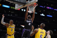 FILE - Sacramento Kings forward Maurice Harkless (8) dunks against the Los Angeles Lakers during the second half of an NBA basketball game Tuesday, Jan. 4, 2022, in Los Angeles. The Atlanta Hawks are trading Kevin Huerter to the Sacramento Kings for Justin Holiday, Mo Harkless and a future conditional draft pick, according to a person with direct knowledge of the agreement. The person spoke to The Associated Press on condition of anonymity Friday, July 1, 2022, because the trade had not been formally approved by the NBA and announced by either club. (AP Photo/Marcio Jose Sanchez, File)