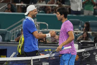 Grigor Dimitrov of Bulgaria and Carlos Alcaraz of Spain greet each other at the end of their match during the Miami Open tennis tournament, Thursday, March 28, 2024, in Miami Gardens, Fla. Dimitrov defeated Alcaraz. 6-2, 6-4. (AP Photo/Marta Lavandier)
