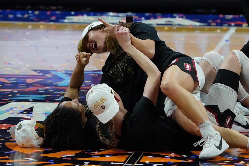 Stanford players celebrate after winning the 2021 NCAA Tournament championship game, defeating Arizona, 54-53.