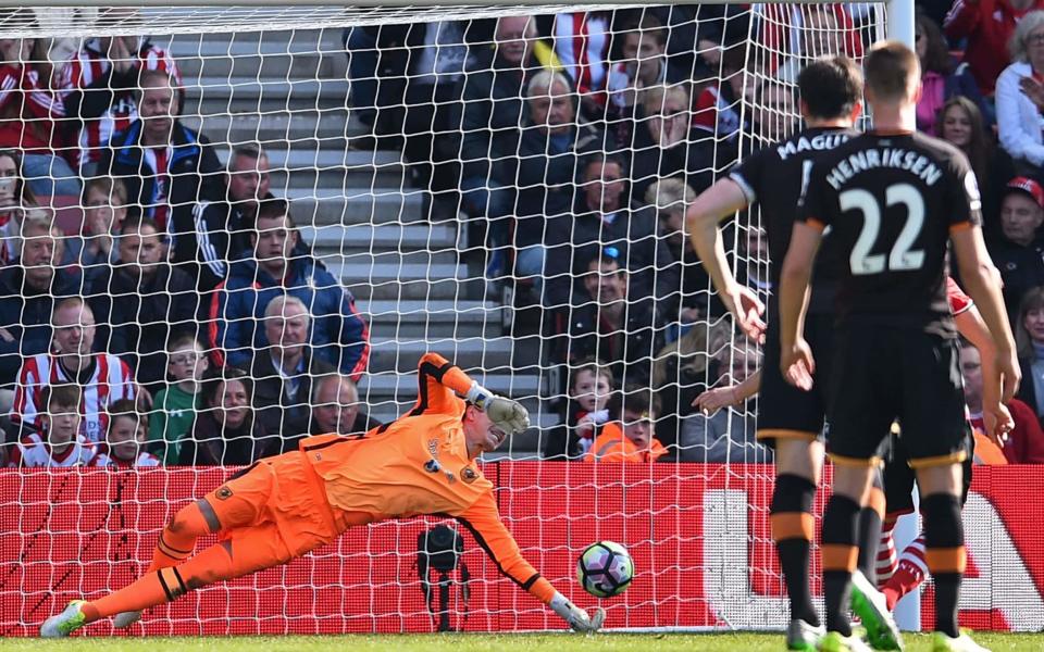 <p>Hull City’s Eldin Jakupovic saves a penalty from Southampton’s Dusan Tadic </p>