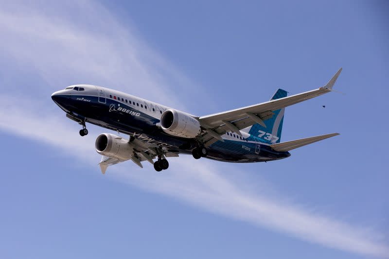 FILE PHOTO: FILE PHOTO: FILE PHOTO: A Boeing 737 MAX airplane lands after a test flight at Boeing Field in Seattle