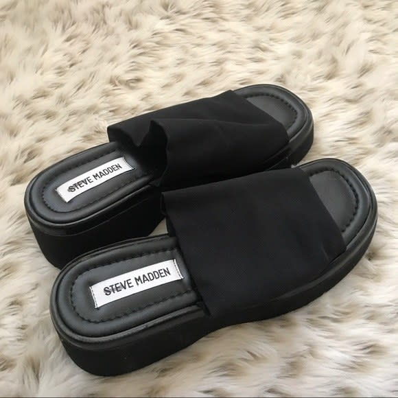 Steve Madden slides on a faux fur carpet