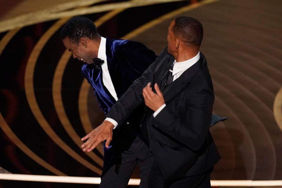Will Smith hits presenter Chris Rock on stage at the Oscars on March 27, 2022.