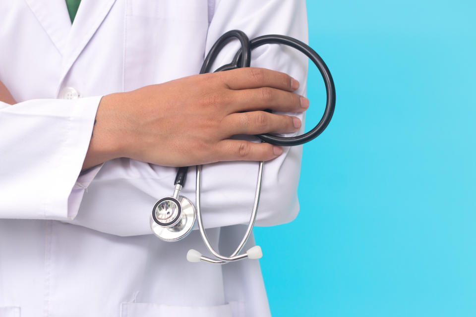 male doctor holding a stethoscope