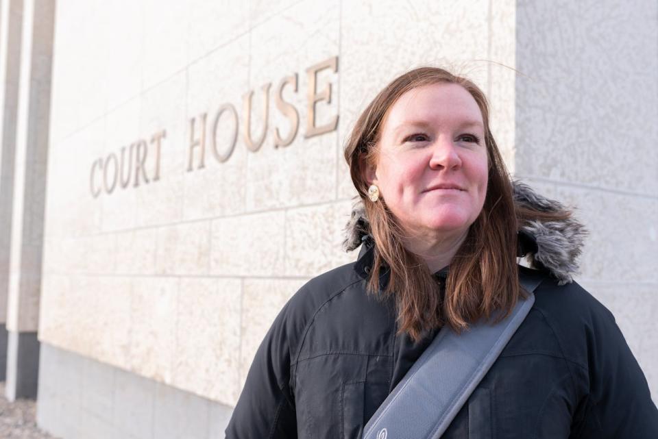 Emily Eaton, a professor in the department of geography and environmental science at the University of Regina, poses for a photo before entering the Court of Queen's Bench in Regina on Wednesday Feb. 26, 2020. 