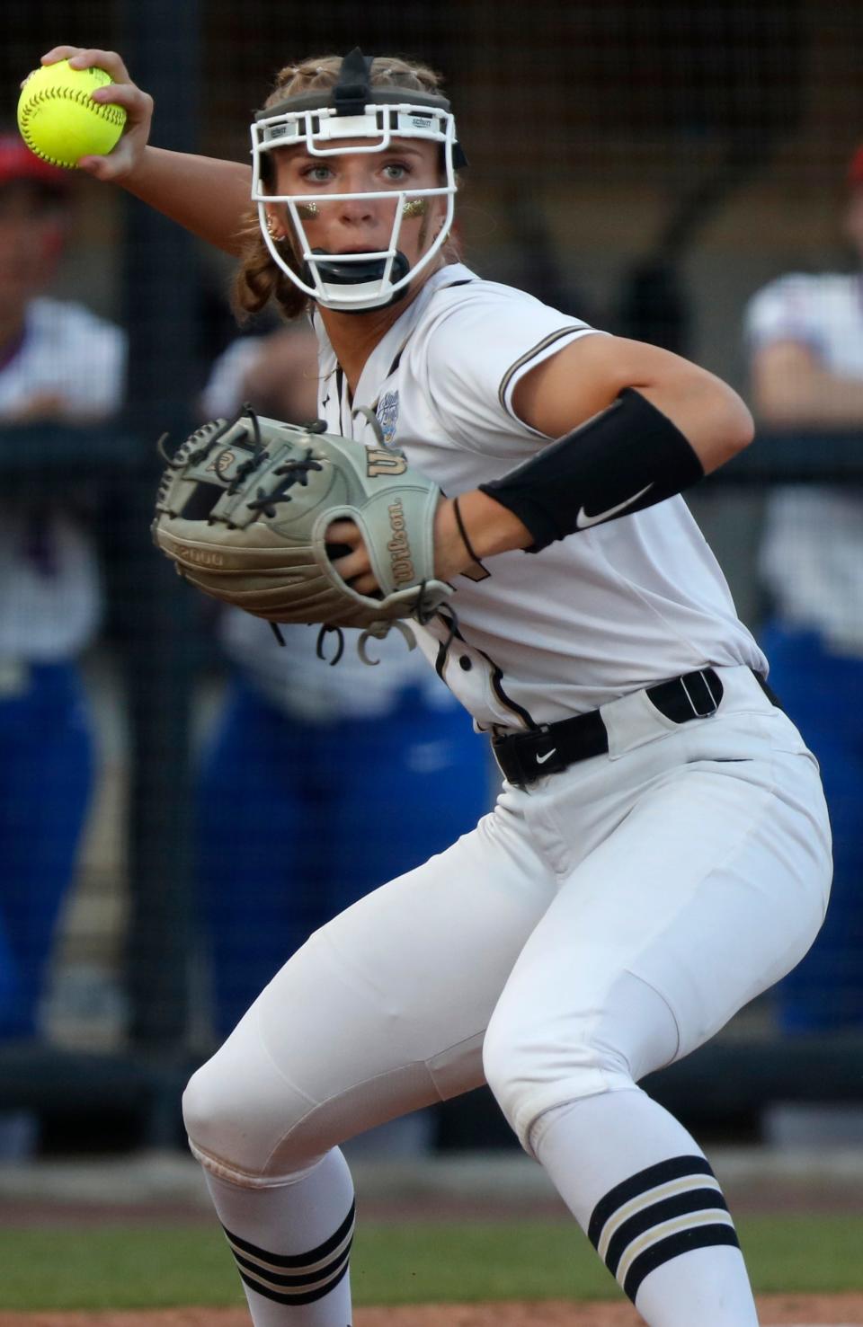 Penn Kingsmen Ava Zachary (12) throws the ball to first base during the IHSAA Class 4A Softball State Final against the Roncalli Royals, Saturday, June 10, 2023, at Purdue University’s Bittinger Stadium in West Lafayette, Ind. Penn won 2-1 in nine innings.