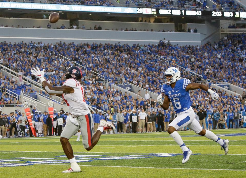 Mississippi wide receiver D.K. Metcalf catches a touchdown pass in front of Kentucky cornerback Lonnie Johnson during the second half of an NCAA college football game Saturday, Nov. 4, 2017, in Lexington, Ky. (AP Photo/David Stephenson)