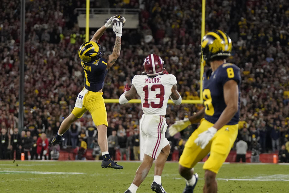 Michigan wide receiver Roman Wilson (1) makes a leaping catch during the second half in the Rose Bowl CFP NCAA semifinal college football game against Alabama, Monday, Jan. 1, 2024, in Pasadena, Calif. (AP Photo/Mark J. Terrill)
