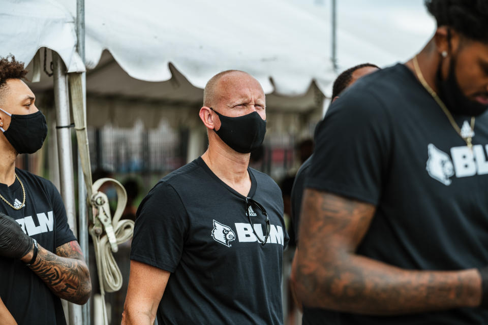 Coach Chris Mack of the Louisville Cardinals men's basketball team joins his players in a protest march on Friday in Louisville, Kentucky. (Photo by Jon Cherry/Getty Images)