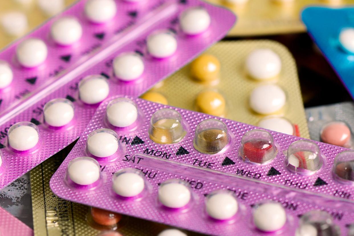 Oral contraceptive pill on pharmacy counter.