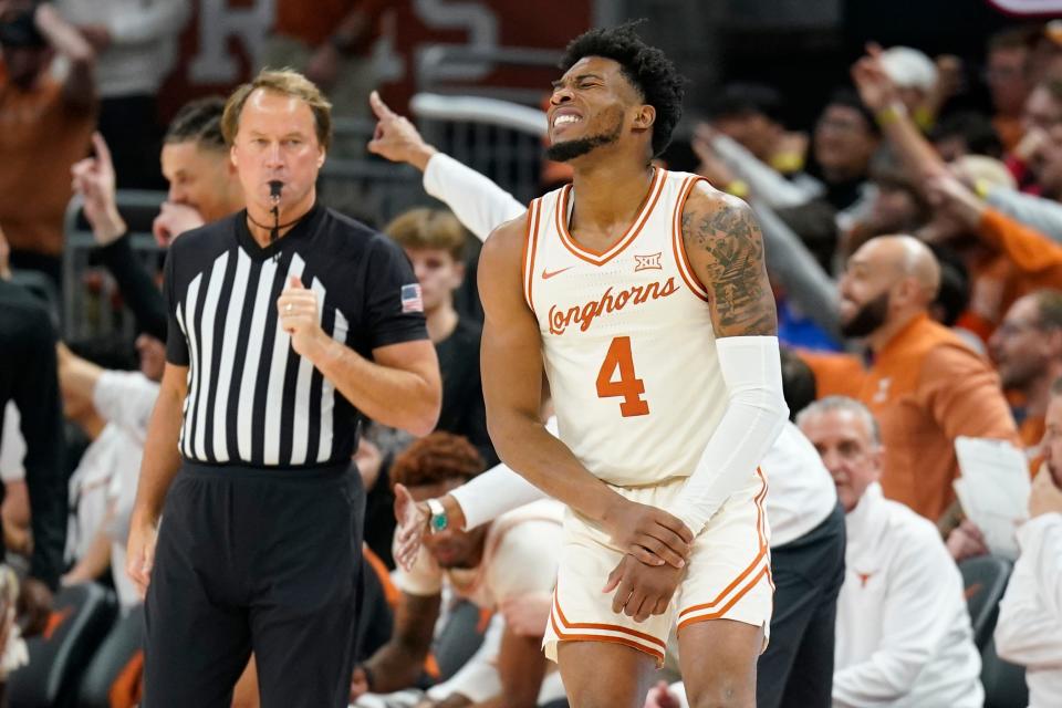 Texas point guard Tyrese Hunter holds his wrist after scoring a basket in the second half of Monday's 76-71win over Baylor, a meeting of the country's No. 10 and No. 11 teams. Texas snapped Baylor's six-game winning streak.