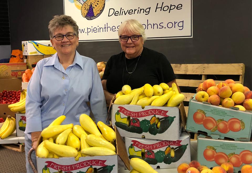 Malea Guiriba, founder and executive director of Pie in the Sky Community Alliance, and program manager Phyllis Wood oversee donated food destined for needy St. Johns County seniors.