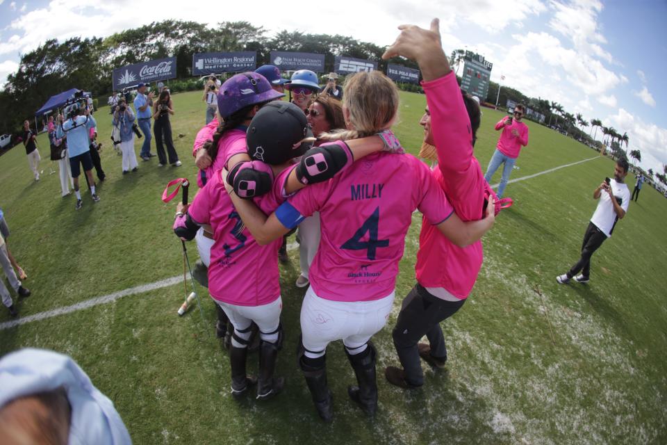Pink-clad Buena Vibra celebrates winning the U.S. Open Women's Polo Championship at the National Polo Center.