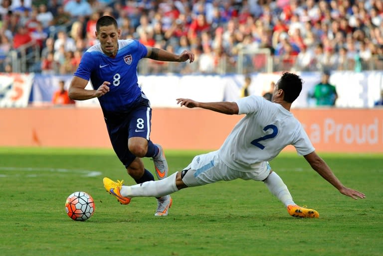 Clint Dempsey (L) of the US manuevers past Ruben Morales of Guatemala during their international friendly match at Nissan Stadium in Nashville, Tennessee, on July 3, 2015