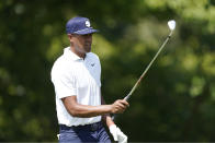 Tony Finau follows prepares to hit from the eighth tee during the second round of the St. Jude Championship golf tournament Friday, Aug. 12, 2022, in Memphis, Tenn. (AP Photo/Mark Humphrey)