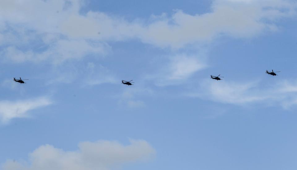 The Air Force Reserve 920th Rescue Wing's HH-60G Pave Hawk helicopters fly inland from Patrick Space Force Base en route to Arkansas on Tuesday in preparation for Tropical Storm Nicole.