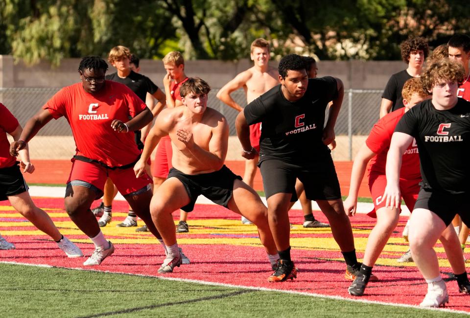 Chaparral defensive lineman Keegan Shank (center left) during conditioning drills at Chaparral High in Scottsdale on July 13, 2023.