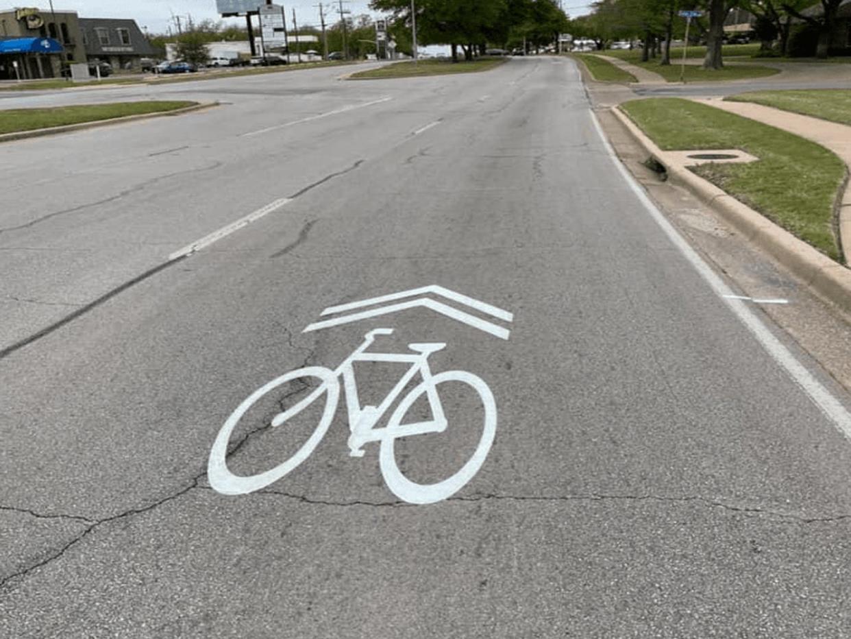 The bicycle emblems on some Wichita Falls streets are to let drivers know the city has a lot of bike riders and to be careful around them.