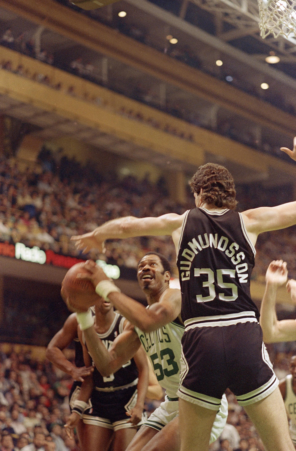 Artis Gilmore of the Boston Celtics looks for room to move under the basket under the watchful defense of Petur Gudmundsson of the <a class="link " href="https://sports.yahoo.com/nba/teams/san-antonio/" data-i13n="sec:content-canvas;subsec:anchor_text;elm:context_link" data-ylk="slk:San Antonio Spurs;sec:content-canvas;subsec:anchor_text;elm:context_link;itc:0">San Antonio Spurs</a> during second quarter NBA action at the Boston Garden in Boston, Mass., March 9, 1988. AP Photo/Elise Amendola