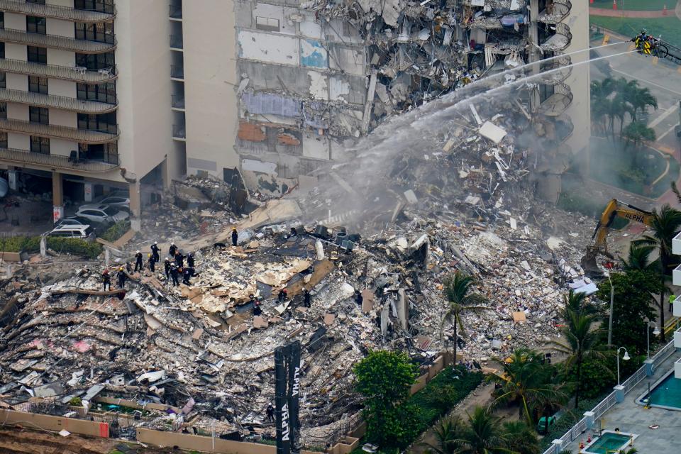 Rescue workers work in the rubble at the Champlain Towers South Condo is seen, Friday, June 25, 2021, in Surfside.