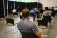 Georgia Tech employee Adam Jackson waits after receiving a Pfizer COVID-19 vaccination at the Vaccination Site on the campus of Georgia Tech on Thursday, April 8, 2021 in Atlanta. U.S. colleges hoping for a return to normalcy next fall are weighing how far they should go in urging students to get the COVID-19 vaccine, including whether they should — or legally can — require it. There’s a parallel debate about whether to require vaccination for faculty and staff, an issue that employers across the nation are grappling with. (AP Photo/Danny Karnik)