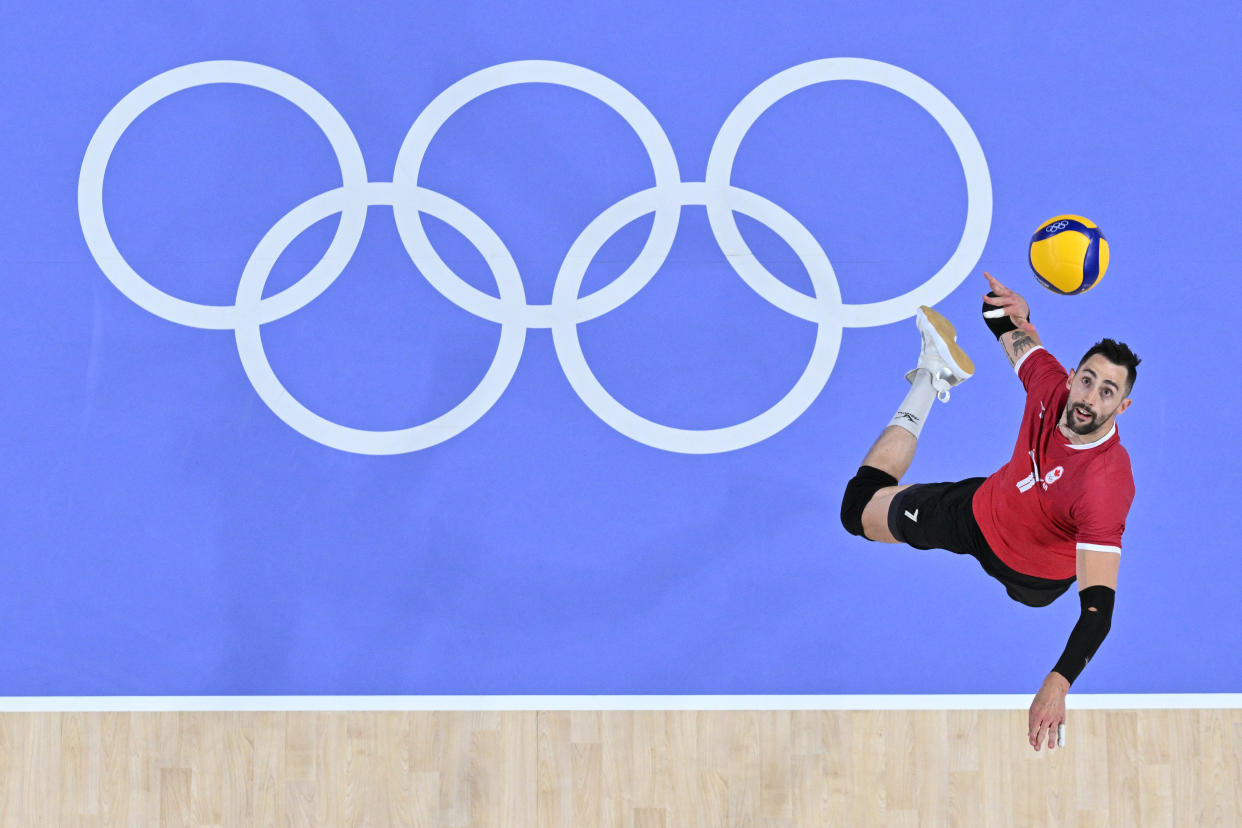 Canada's Stephen Timothy Maar serving during the men's preliminary round volleyball match between Slovenia and Canada.