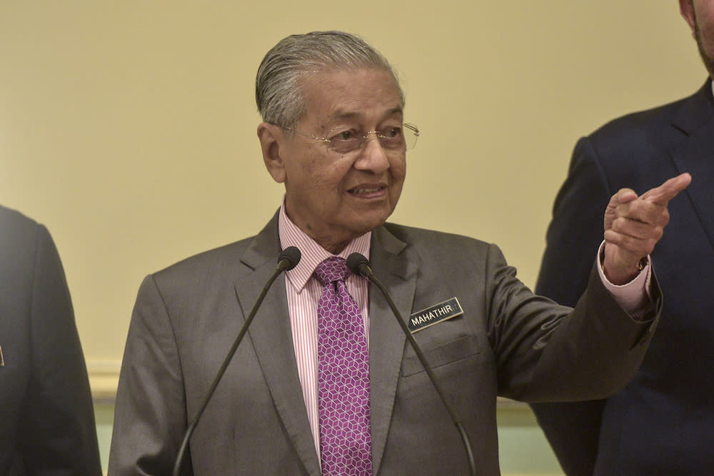 Prime Minister Tun Dr Mahathir Mohamad said the government would introduce legislation to rein in recalcitrant local companies that turn a blind eye to open burning on their land outside the country.. — Picture by Shafwan Zaidon