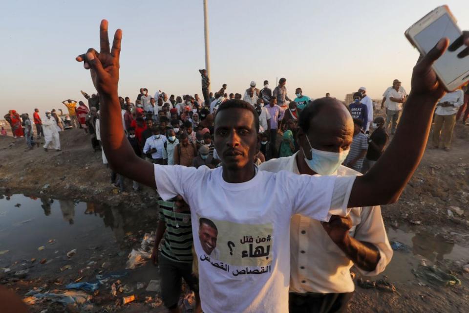 A Sudanese mourner wearing a shirt asking who killed Bahaa Eddine Nouri, a pro-democracy activist. It’s alleged they were tortured and killed by members of the Rapid Support Forces. Ashraf Shazly/AFP via Getty Images