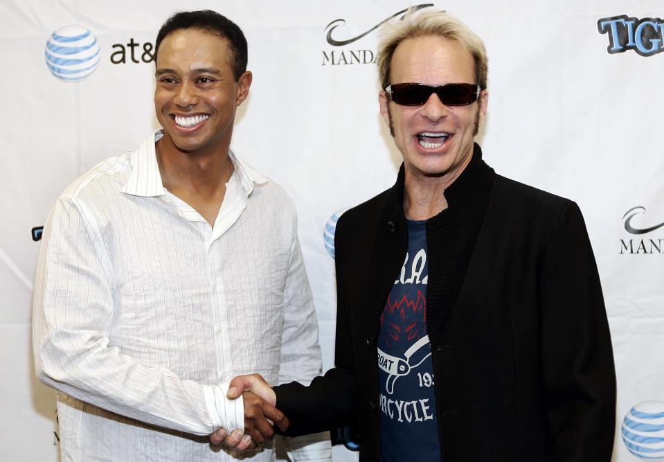 (L-R) Tiger Woods and David Lee Roth arrive at the 11th Annual Tiger Jam benefit concert hosted by Tiger Woods and featuring Van Halen at the Mandalay Bay Events Center in Las Vegas. (Photo by Chris Farina/Corbis via Getty Images)