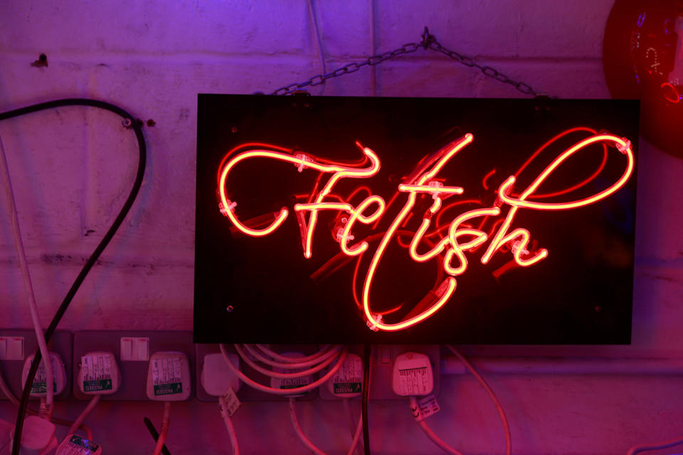 A neon sign that reads ‘Fetish’