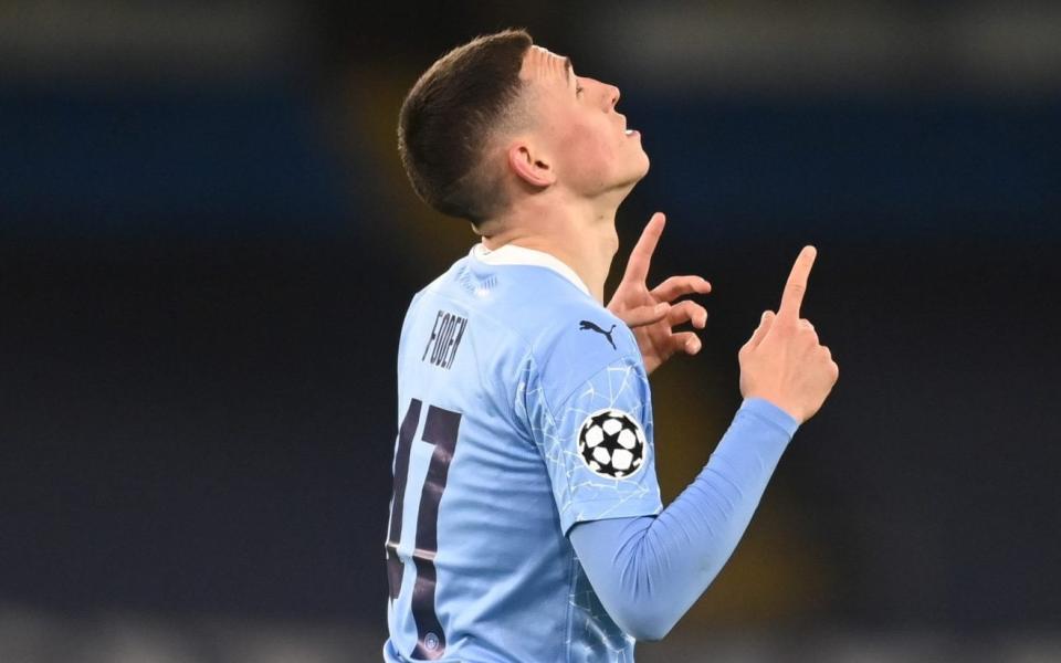 Phil Foden of Manchester City celebrates after scoring their team's second goal during the UEFA Champions League Quarter Final match between Manchester City and Borussia Dortmund - Michael Regan/Getty Images