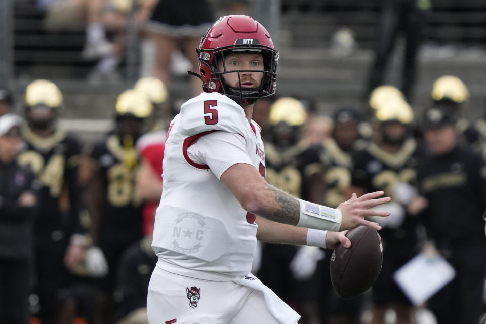 North Carolina State quarterback Brennan Armstrong looks to pass against Wake Forest during the first half of an NCAA college football game in Winston-Salem, N.C., Saturday, Nov. 11, 2023. (AP Photo/Chuck Burton)