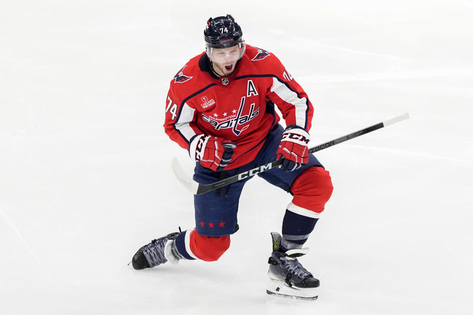 Washington Capitals defenseman John Carlson celebrates after scoring in the third period of an NHL hockey game against the Winnipeg Jets, Sunday, March 24, 2024, in Washington. (AP Photo/Mark Schiefelbein)