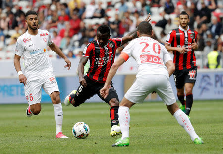 Football Soccer - Nice v Nancy - French Ligue 1 - Allianz Riviera Stadium, Nice, France 15/04/2017 - Nice's Jean Michael Seri in action with Nancy's Michael Chretien. REUTERS/Eric Gaillard