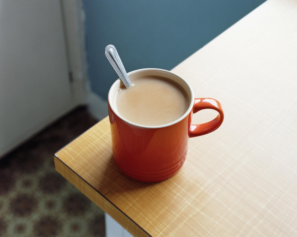 Red tea mug with spoon