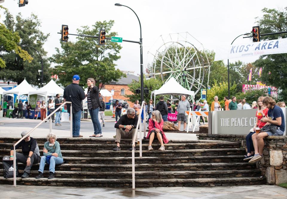 Festival attendees listen to the music of The Patrick Lopez Experience during Fall for Greenville on Friday, October 8, 2021